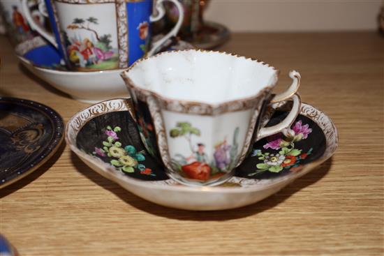 A group of Dresden cup saucers and covers, a Russian tea cup and other Continental porcelain cups